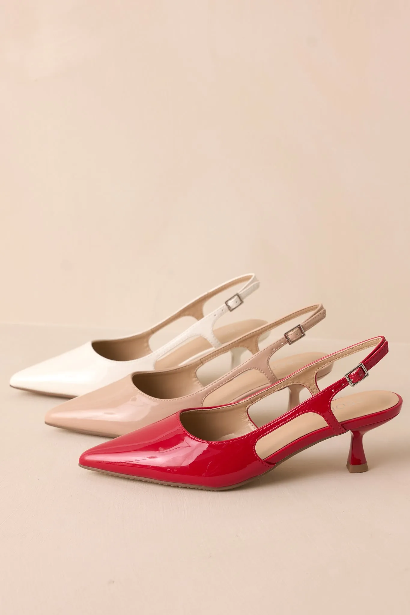 Fiercely Stunned Nude Patent Kitten Heels